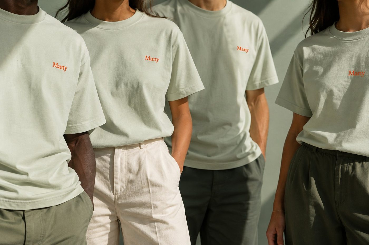 People standing together in sage Many T-shirts